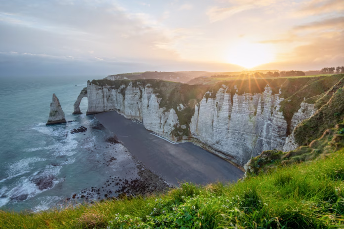 Picturesque panoramic landscape on the cliffs of Etretat. Natural amazing cliffs. Etretat, Normandy, France, La Manche or English Channel. Coast of the Pays de Caux area in sunny summer day. France