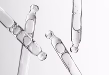 Retinal ali retinol: poznaš razliko? Skin serum in a pipette. A cosmetic product for body care. White background