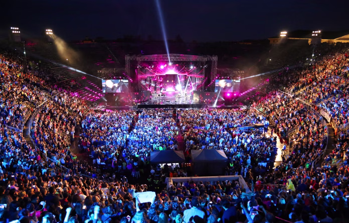 verona-vr-italy-june-5-2017-live-concert-inside-the-ancient-roman-arena-with-many-people-and-stage-stockpack-istock Verona, VR, Italy - June 5, 2017: Live concert inside the Ancient Roman Arena with many people and stage