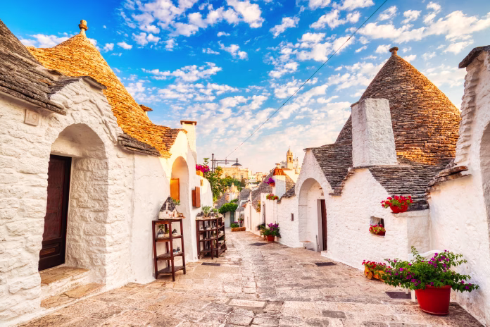 Famous Trulli Houses during a Sunny Day with Bright Blue Sky in Alberobello, Puglia, Italy