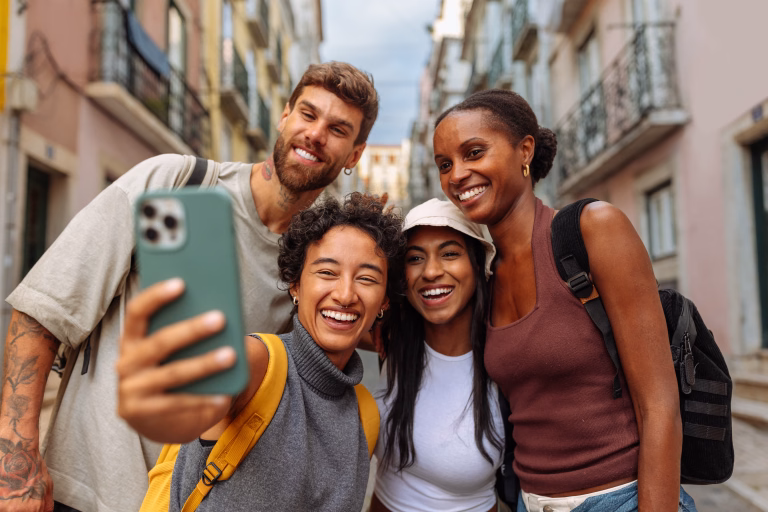 Four young people taking a selfie