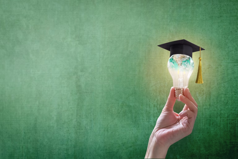 Innovative learning, creative educational study concept for graduation and school student success with world lightbulb on teacher chalkboard