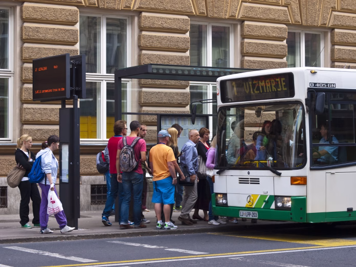 ljubljana-slovenia-july-26-2011-a-view-of-the-people-in-line-and-slowly-going-on-the-bus-at-bus-station-in-front-of-main-post-office-in-center-of-ljubljana-on-left-side-is-panelwith-bus-line-nimber-an-stockpack-istock Ljubljana, Slovenia - july 26, 2011: A view of the people in line and slowly going on the bus at bus station in front of main Post office in center of Ljubljana. On left side is panelwith bus line nimber and time when it will leave.