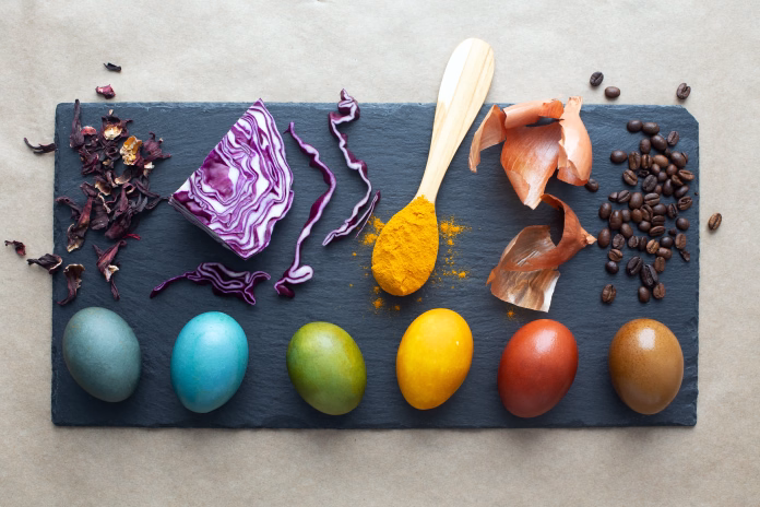 Natural dye for easter eggs - carcade, red cabbage, turmeric, onion skin and coffee. Homemade colored easter eggs with ingredients