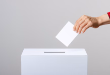 Kje predčasno glasovati? V pomoč vam je lahko … Voting and people hands and gray background