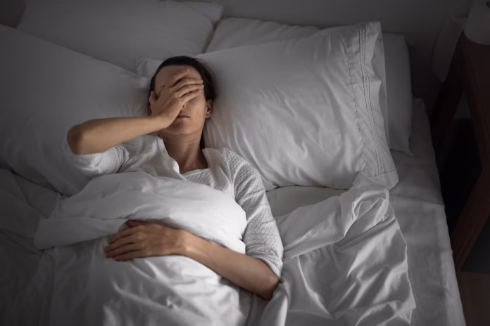 woman-feeling-sick-and-tired-in-the-bed-stockpack-istock Woman feeling sick and tired in the bed.