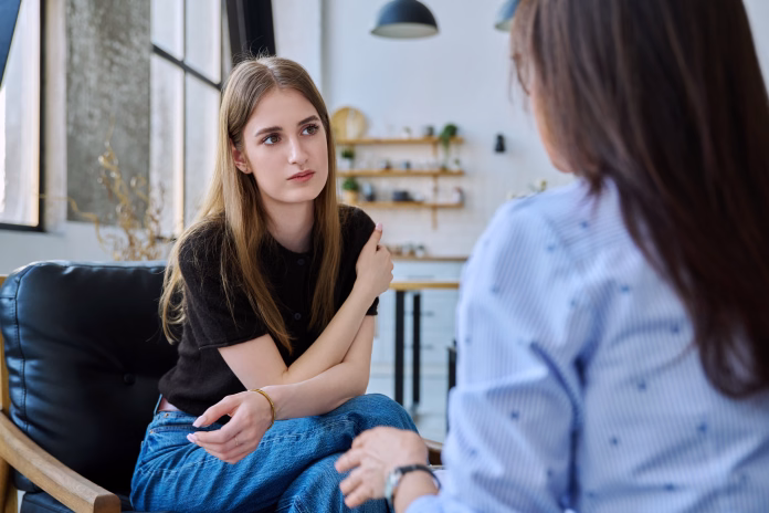 young-woman-talking-to-social-worker-home-meeting-home-visit-of-psychological-counselor-survey-consultation-social-services-psychology-psychotherapy-help-treatment-support-mental-health-youth-stockpack-istock Young woman talking to social worker, home meeting, home visit of psychological counselor, survey consultation. Social services, psychology psychotherapy help treatment support, mental health, youth