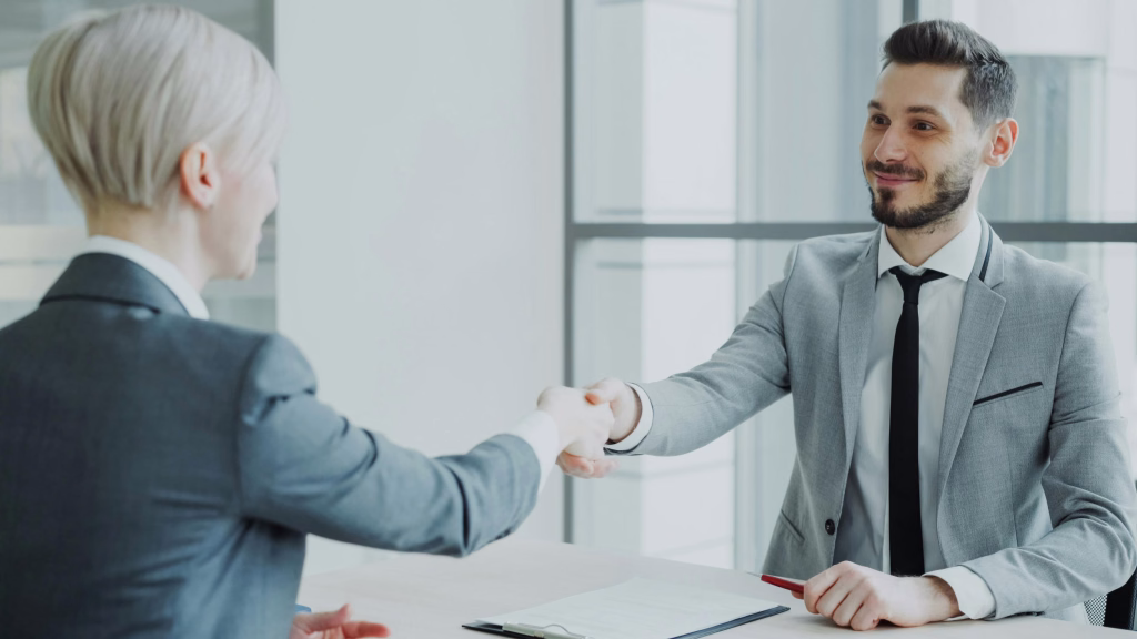 Business handshake in modern office setting