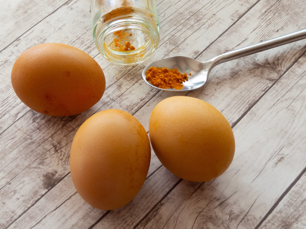 Easter eggs with their natural dye of curcuma