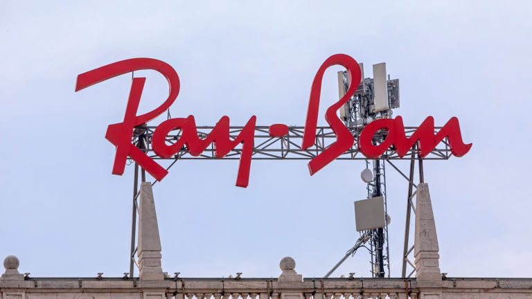 Milan, Italy - June 15, 2019: Big Red Ray Ban Sign at Top of Building in Milan, Italy.