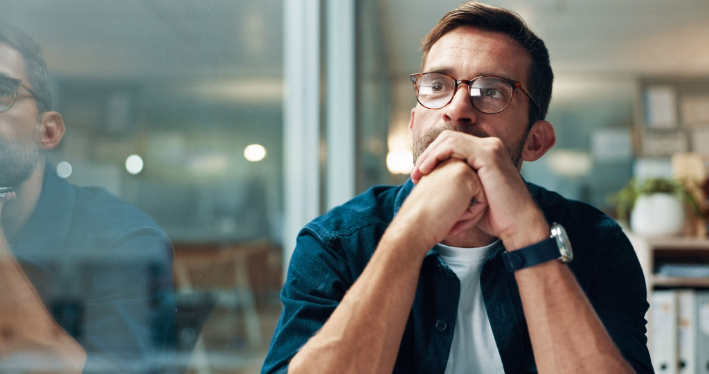 Reflection, thinking and business man with idea, creative insight or professional mindset. Planning, vision and serious worker with inspiration, problem solving and writer by glass in startup office
