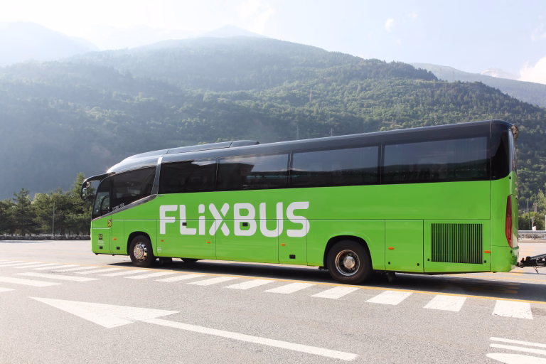 Salbertrand, Italy - July 10, 2023: Flixbus bus stopped at a motorway rest area. Flixbus is a brand which offers intercity bus service in Europe