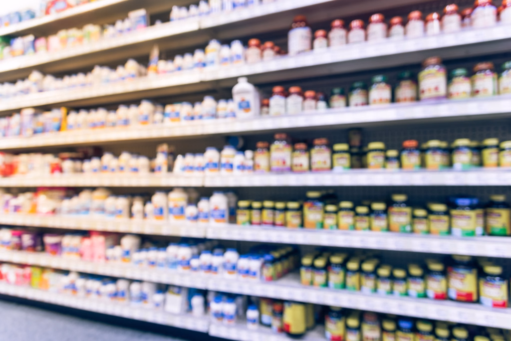 Vintage blurred image vitamin store shelves, huge variation of vitamins, supplements, natural remedies, functional food, lifestyle support, herbal. Medical supplies product abstract background