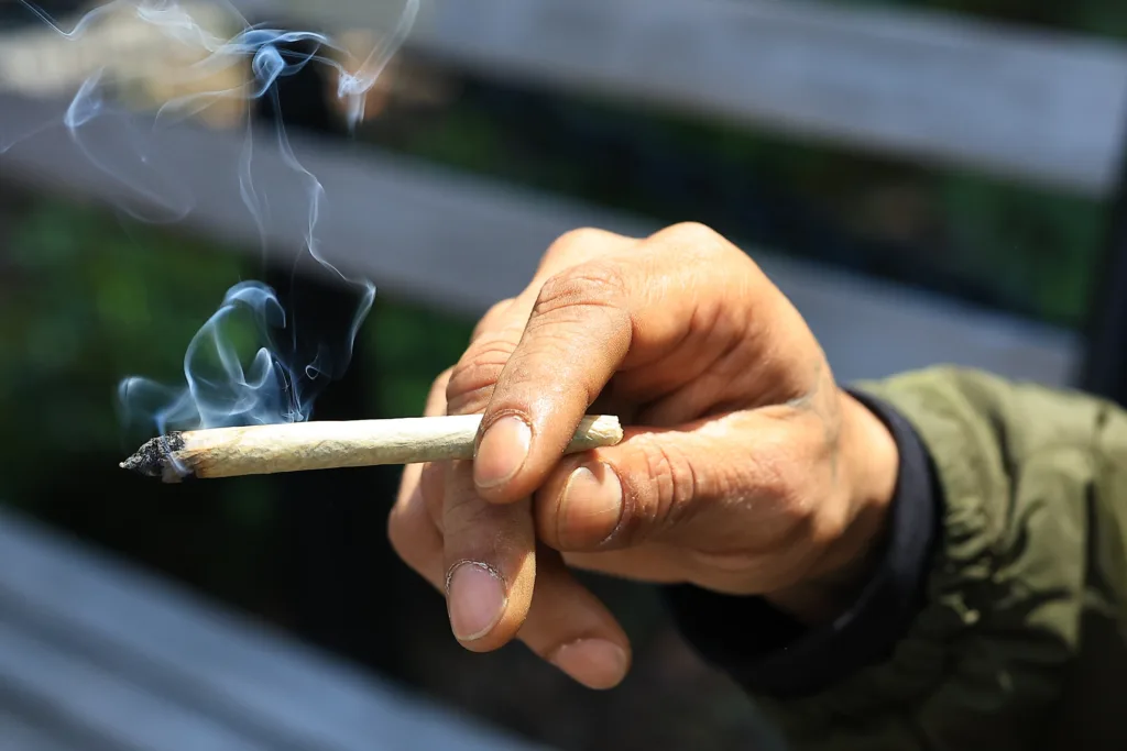 A man holds a joint while attending the 420 Festivities at Washington Square Park in New York, N.Y., Saturday, April 20, 2024. People around the world are celebrating their favorite guilty pleasure: marijuana. (Photo: Gordon Donovan)
