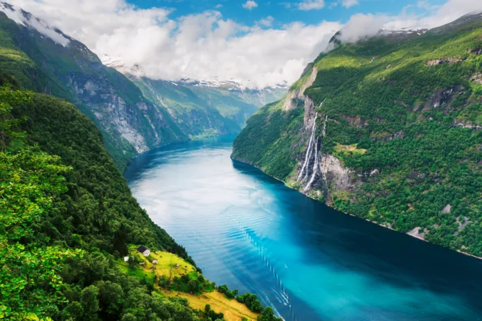 Breathtaking view of Sunnylvsfjorden fjord and famous Seven Sisters waterfalls, near Geiranger village in western Norway.