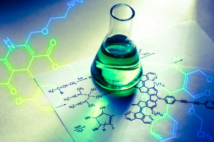 chemical-tube-with-reaction-formula-in-light-stockpack-istock Chemical tube with reaction formula in light