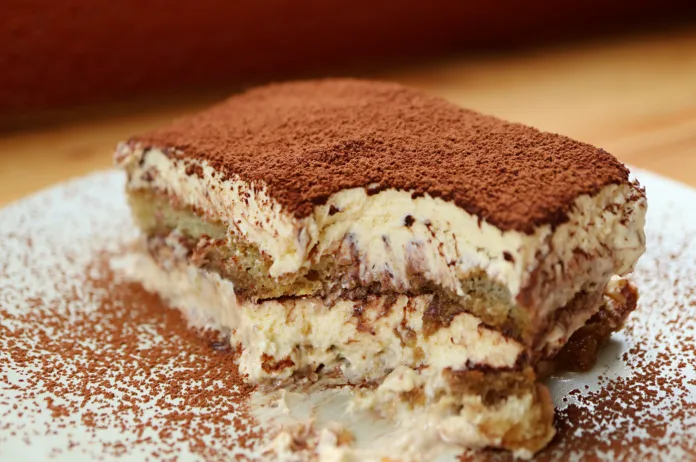 closeup-of-a-slice-of-tiramisu-after-scooped-with-spoon-stockpack-istock Closeup of a slice of Tiramisu after scooped with spoon