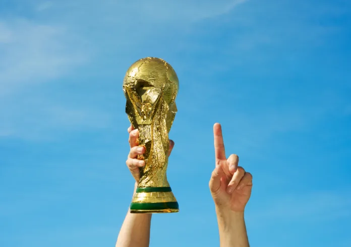 "Los Angeles, California, USA - May 12th 2010: Hands holding up a replica of the Soccer World Cup previous to South Africa\'s Tournament."