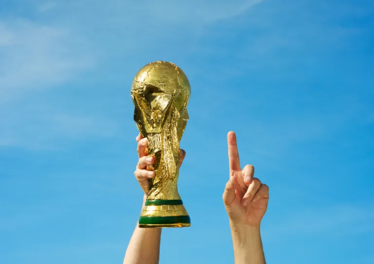 "Los Angeles, California, USA - May 12th 2010: Hands holding up a replica of the Soccer World Cup previous to South Africa\'s Tournament."