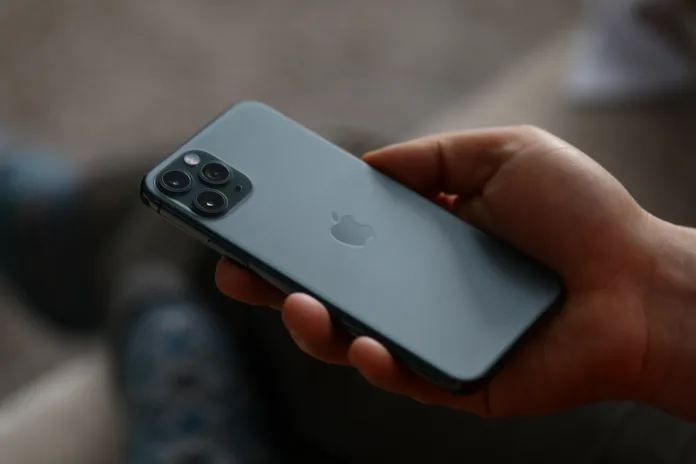 minsk-belarus-december-11-2019-a-man-holds-a-new-model-apple-iphone-backside-up-closeup-illustrative-editorial-stockpack-istock Minsk, Belarus - December 11, 2019: A man holds a new model apple iphone backside up closeup . Illustrative editorial