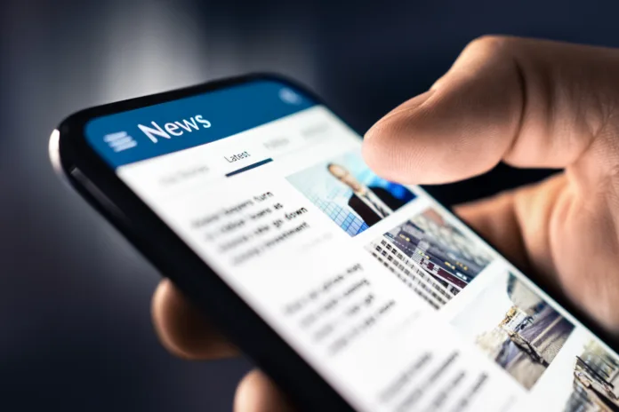 news-and-press-release-headlines-and-newspaper-media-in-phone-reading-articles-online-mobile-in-hand-feed-breaking-report-or-business-publication-latest-daily-journalism-stockpack-istock News and press release. Headlines and newspaper media in phone. Reading articles online. Mobile in hand. Feed, breaking report, or business publication. Latest daily journalism.