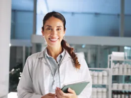 Portrait, woman and scientist on tablet in lab for research, medical investigation and pharmaceutical report. Person, smile and digital for about us, biology study and information of vaccine solution