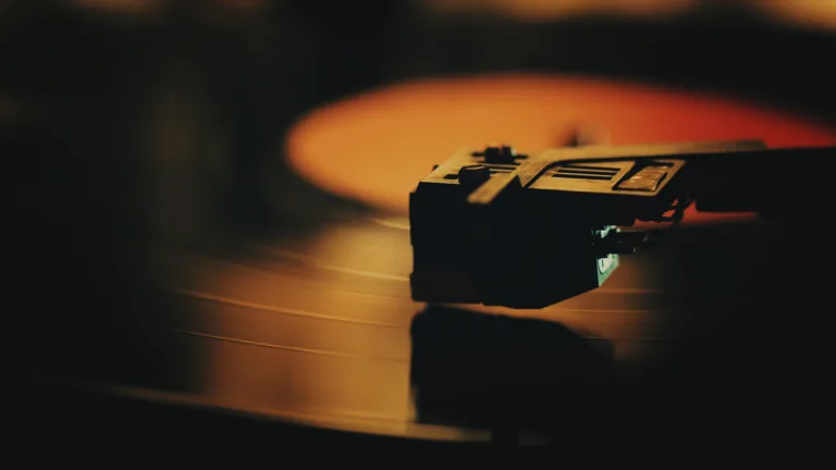 Record player turntable stock footage. A record player turntable with it's stylus running along a vinyl record.
