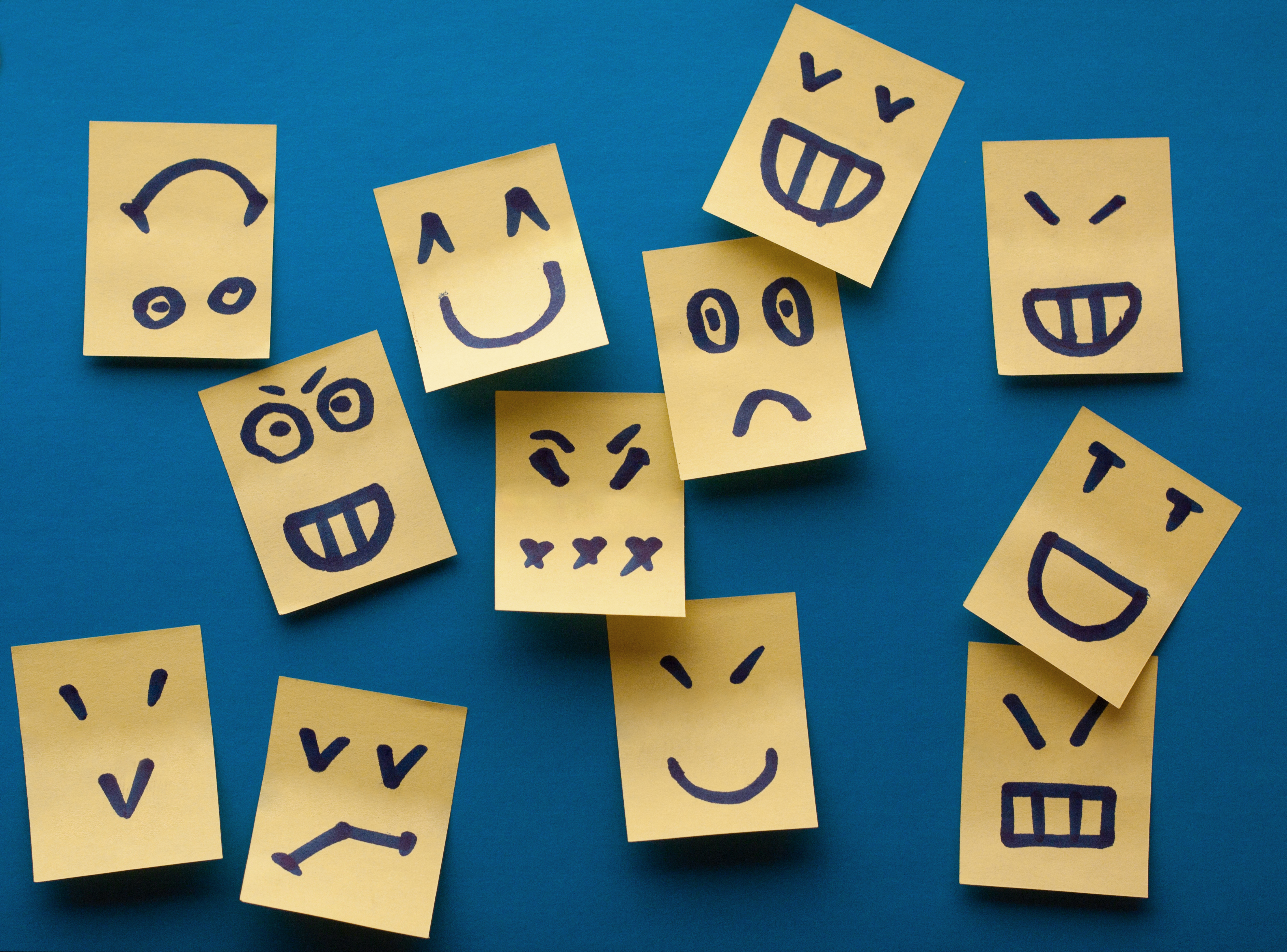 smilies-stickers-on-blue-background-stockpack-istock Smilies stickers on blue background