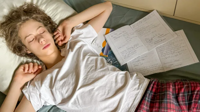 tired-student-napping-after-studying-concepts-of-academic-burnout-distance-learning-fatigue-teen-mental-health-and-study-life-balance-stockpack-istock Tired Student Napping After Studying. Concepts of Academic Burnout, Distance Learning Fatigue, Teen Mental Health, and Study-Life Balance
