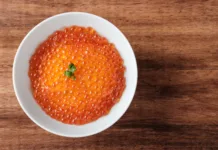Slovenija ostaja Michelinova velesila: Priporočila za slovenske restavracije Top View of Salmon Roe (Ikura) in a White Bowl with copy space for your text.