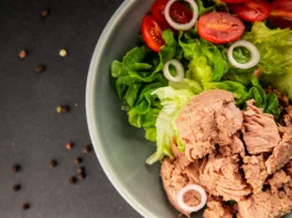 Tuna salad green leaf lettuce, canned tuna, tomato fresh delicious gourmet food background on the table rustic food top view copy space keto and paleo diet vegetarian food pescetarian diet