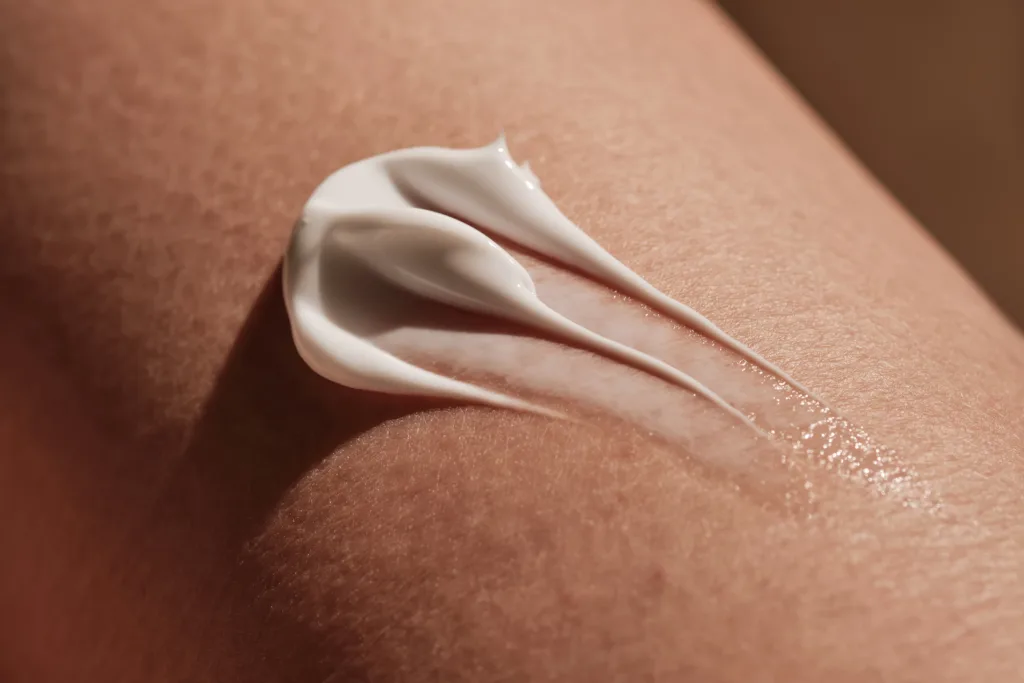 White body cream on human skin. High quality photo.