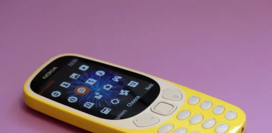 Chorleywood, Hertfordshire, England, UK - June 5th 2019: The new Nokia 3310 feature phone issued in 2017 on a pink background