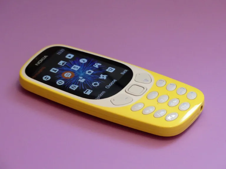 Chorleywood, Hertfordshire, England, UK - June 5th 2019: The new Nokia 3310 feature phone issued in 2017 on a pink background
