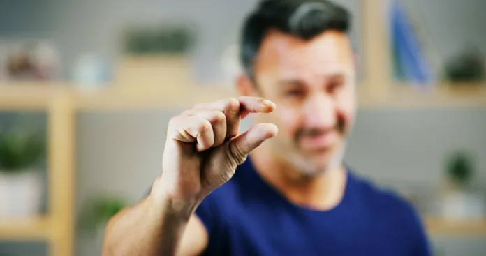 man-hands-and-sign-for-small-size-measurement-or-emoji-in-creative-startup-fingers-pinch-and-person-with-tiny-gesture-for-minimalist-design-scale-or-show-little-symbol-for-growth-in-niche-market-stockpack-istock Man, hands and sign for small size, measurement or emoji in creative startup. Fingers, pinch and person with tiny gesture for minimalist design, scale or show little symbol for growth in niche market