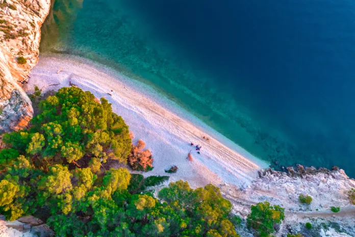 Nugal Beach. Nude beach on the Makarska riviera in Croatia. Adriatic sea pebble beach. The beach among mountains.