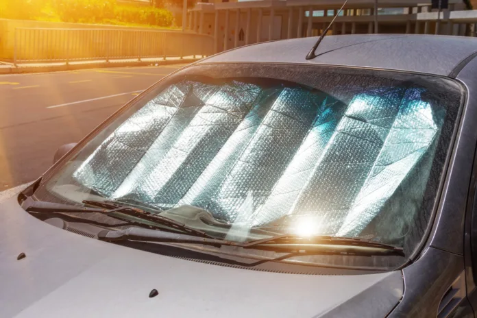 protective-reflective-surface-under-the-windshield-of-the-passenger-car-parked-on-a-hot-day-heated-by-the-suns-rays-inside-the-car-stockpack-istock Protective reflective surface under the windshield of the passenger car parked on a hot day, heated by the sun's rays inside the car