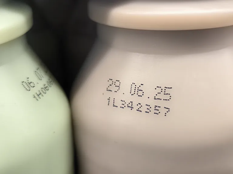 Select focus of the expiration date stamped on milk bottle. Expire date. Dairy product