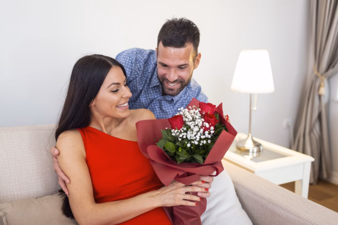 affectionate-young-man-giving-his-beautiful-young-wife-a-bouquet-of-red-roses-on-valentines-day-to-surprise-his-girlfriend-romantic-happy-couples-sharing-gift-together-on-valentines-day-stockpack-istock Affectionate young man giving his beautiful young wife a bouquet of red roses on Valentines day to surprise his girlfriend, romantic happy couples sharing gift together on Valentines day