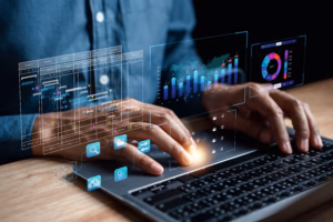 Analyst working with computer in Business Analytics and Data Management System to make report with KPI and metrics connected to database. Corporate strategy for finance, operations, sales, marketing.