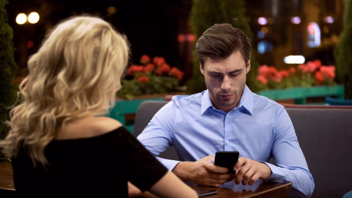 businessman-not-paying-attention-to-his-girlfriend-addicted-to-gadget-problem-stockpack-istock Businessman not paying attention to his girlfriend, addicted to gadget, problem