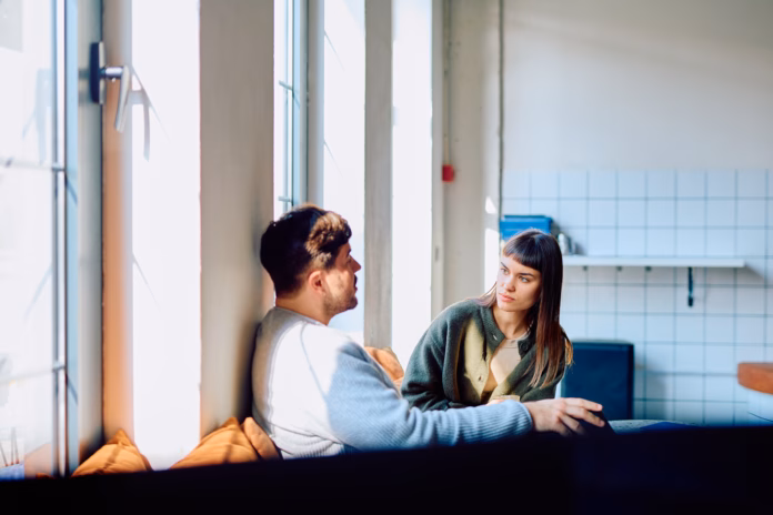 man-and-woman-having-a-focused-conversation-sitting-near-a-window-in-a-bright-interior-sharing-thoughts-and-listening-stockpack-istock Man and woman having a focused conversation, sitting near a window in a bright interior. Sharing thoughts and listening
