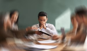Stress, migraine and motion blur with a business man in a meeting feeling frustrated, tired or overworked. Mental health, anxiety and headache with an exhausted male employee suffering from fatigue