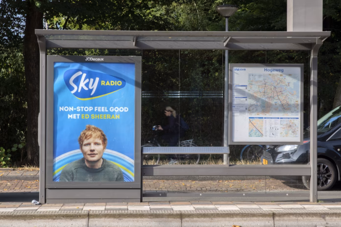 tram-stop-with-advertising-sky-radio-with-ed-sheeran-at-amsterdam-the-netherlands-7-9-2022-stockpack-istock Tram Stop With Advertising Sky Radio With Ed Sheeran At Amsterdam The Netherlands 7-9-2022