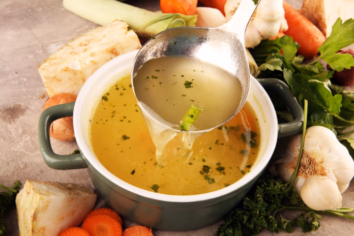 broth-with-carrots-onions-various-fresh-vegetables-in-a-pot-colorful-fresh-clear-spring-soup-rural-kitchen-scenery-vegetarian-bouillon-stockpack-istock Broth with carrots, onions various fresh vegetables in a pot - colorful fresh clear spring soup. Rural kitchen scenery vegetarian bouillon