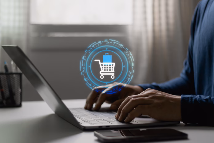 customer-typing-on-laptop-with-shopping-cart-icon-online-shopping-ecommerce-transaction-digital-retail-technology-business-payment-consumerism-purchase-across-mobile-and-computer-platforms-stockpack-istock Customer typing on laptop with shopping cart icon, online shopping, ecommerce transaction, digital retail. Technology business, payment, consumerism, purchase across mobile and computer platforms.