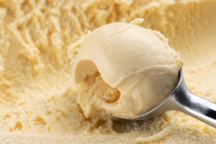 scoop-the-vanilla-ice-cream-with-an-ice-cream-scoop-stockpack-istock Scoop the vanilla ice cream with an ice cream scoop.